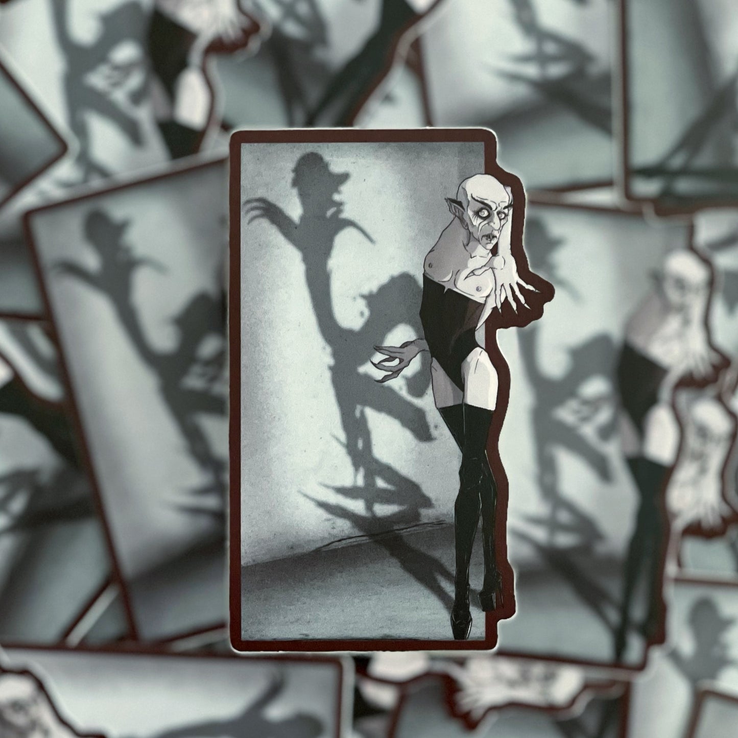 A sticker depicting Nosferatu slaying the day and voguing for his life.