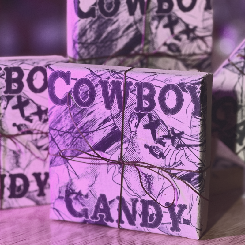 a picture showing the packaging of the cowboy candy enamel pin box