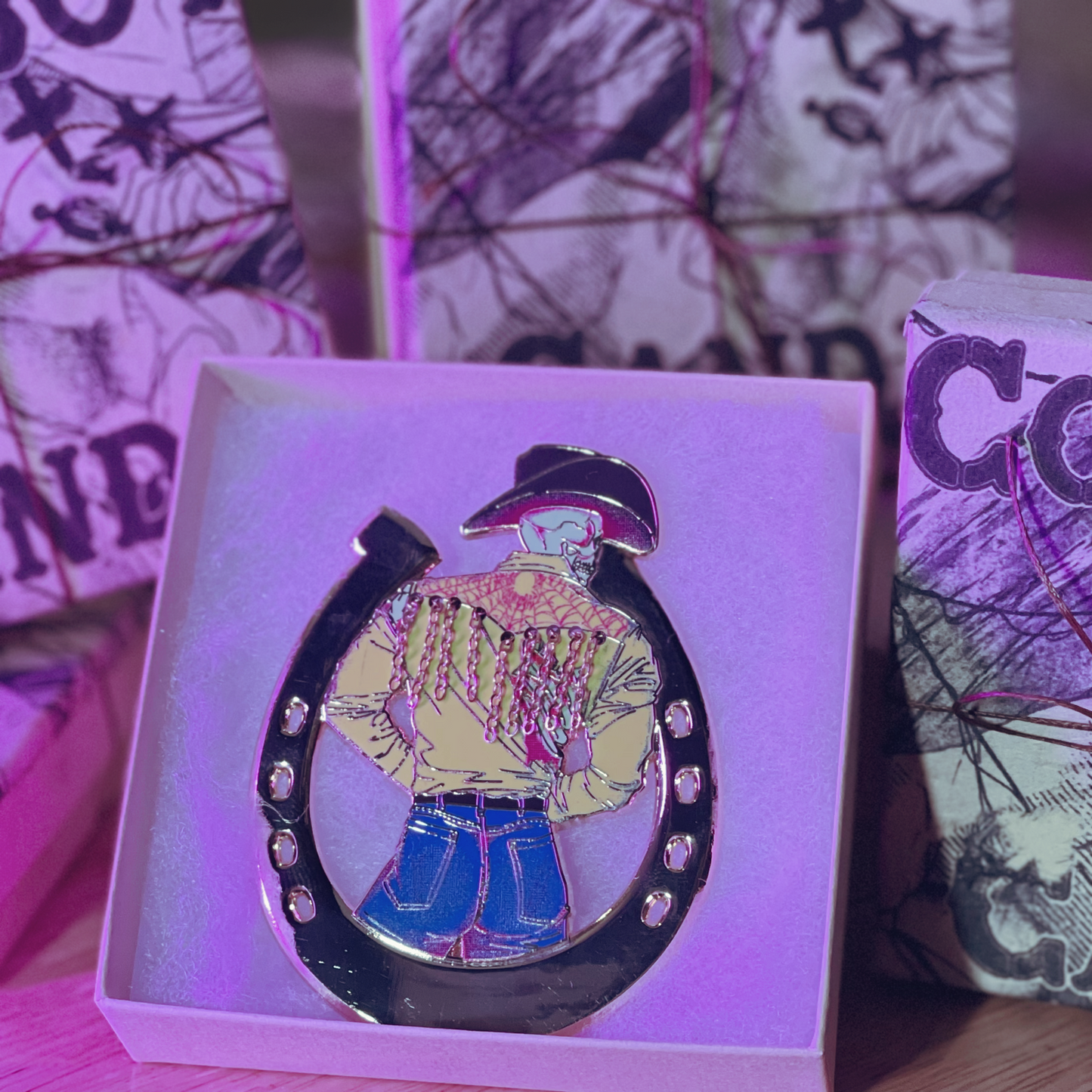 cowboy candy enamel pin featured in box.