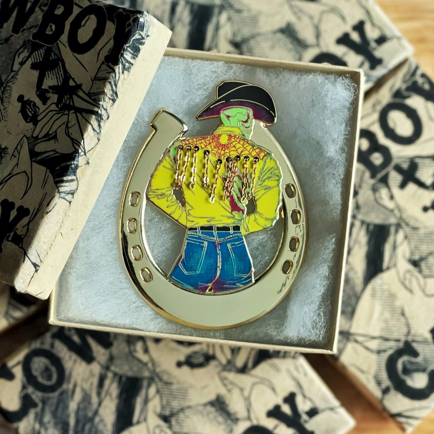 Photo depicting the cowboy candy enamel pin