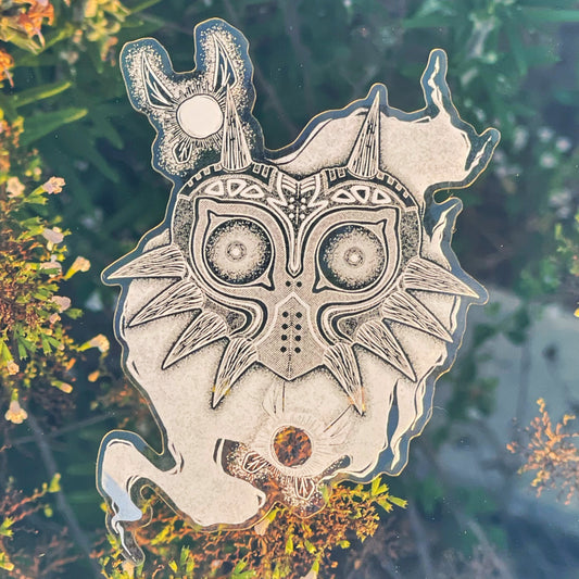 an image featuring a design inspired by Legend of Zelda Majoras mask prinjted in white ink on clear vinyl
